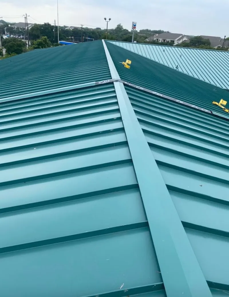 Green commercial metal roof ridge and valley for Metal Roof Repair in Fairport